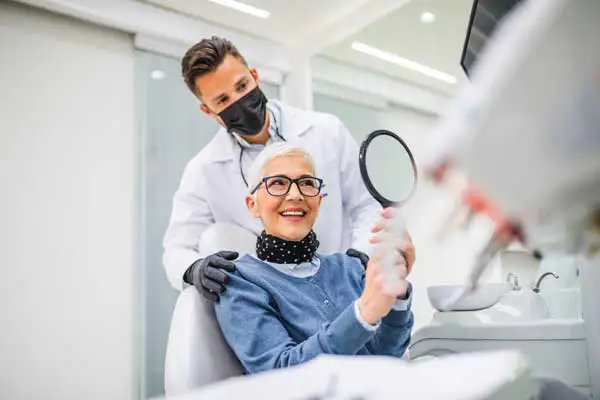 Beautiful senior woman with same day implants at Riverwind Dental in Richmond, VA