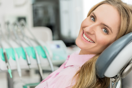 Woman smiling after getting a dental bond at Riverwind Dental in Richmond, VA 
