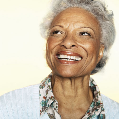 Older woman smiling with a dental bridge from Riverwind Dental in Richmond, VA