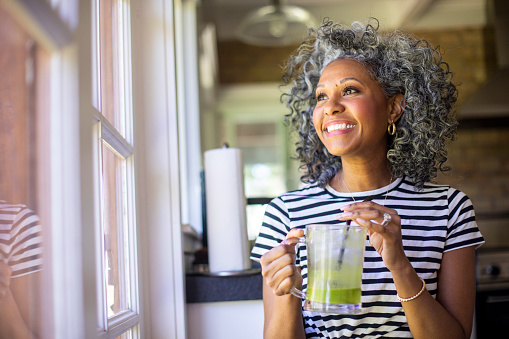 Smiling woman with dental implants from Riverwind Dental in Richmond, VA