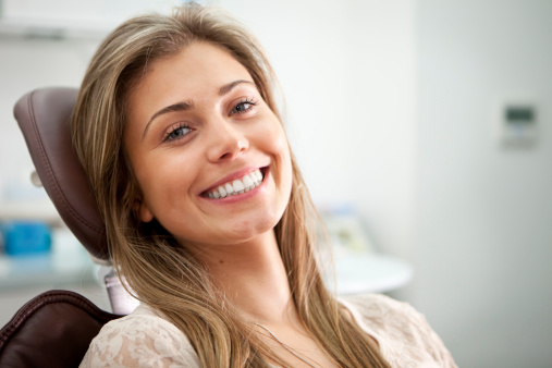 Woman smiling after getting dental implants at Riverwind Dental in Richmond, VA