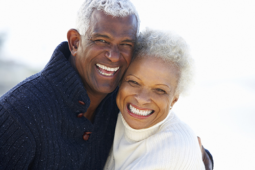 Older man and woman couple with dental implants from Riverwind Dental in Richmond, VA