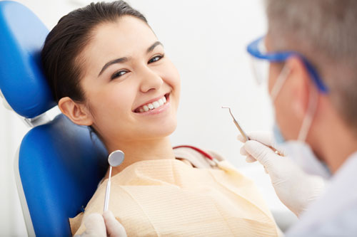 A woman smiling after receiving scaling and root planing therapy at Riverwind Dental in Richmond, VA