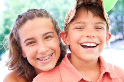 Children with healthy teeth smiling at Riverwind Dental in Richmond, VA